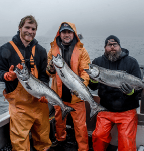 Veterans display the salmon caught on their fishing expedition. 